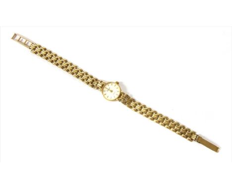 A ladies' 9ct gold quartz bracelet watch, circular case 16mm diameter, with a white dial and raised gilt baton hour markers, 