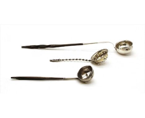A silver strainer having figural terminal, together with a baleen handled toddy ladle and one other (3)