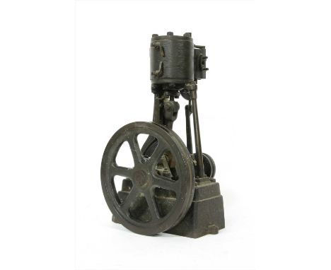 A cast iron section of a pulley or engine mechanism, late 19th century, with two wheels, 39cm high
