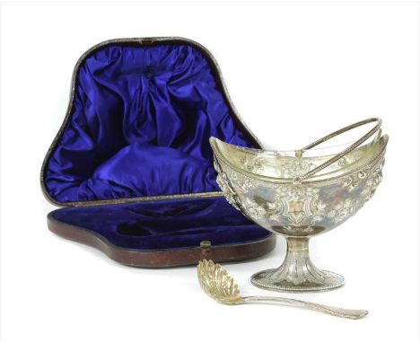 A Victorian swing handled sugar basin , Sheffield 1868, maker Martin Hall &amp; Co., of navette form and decorated in relief 
