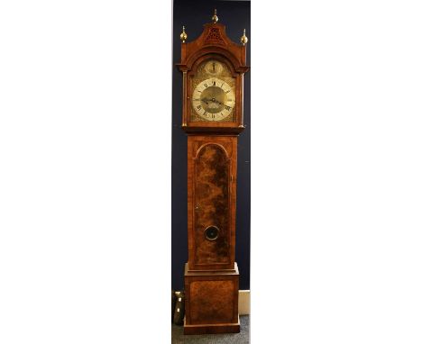 A walnut longcase clock, the five pillar movement with arched brass dial, inscribed William Beaumont, London. The case made i