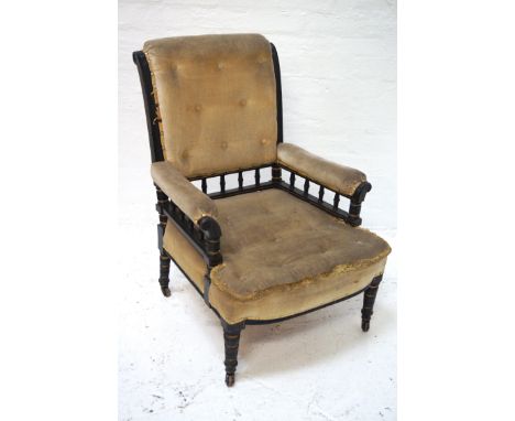 VICTORIAN ARMCHAIR
the ebonised frame with gilt detail, button back and seat with railed padded arms, taupe fabric covering, 