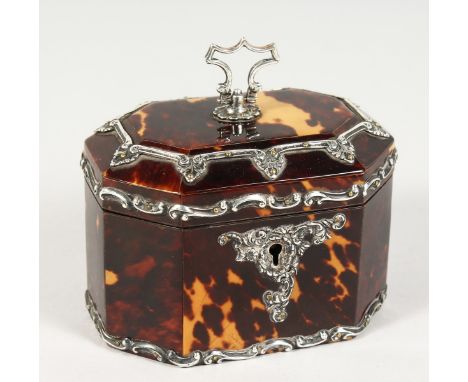A VERY GOOD SMALL SILVER MOUNTED TORTOISESHELL TEA CADDY of long hexagonal shape, with hinged top and inner lid. 4.5ins long 