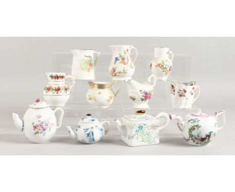 SEVEN ROYAL WORCESTER CREAM JUGS using past Royal Worcester patterns and four Victoria and Albert teapots and covers.