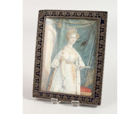 A SILVER AND ENAMEL RECTANGULAR UPRIGHT PHOTOGRAPH FRAME, portrait three-quarter length of a lady. 6ins x 4.5ins.