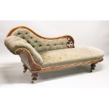 A VICTORIAN MAHOGANY CHAISE LONGUE, with carved and pierced frame, on turned and carved feet with