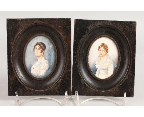 A PAIR OF OVAL PORTRAIT MINIATURES in wooden frames. 3ins x 2ins.  Monogrammed.