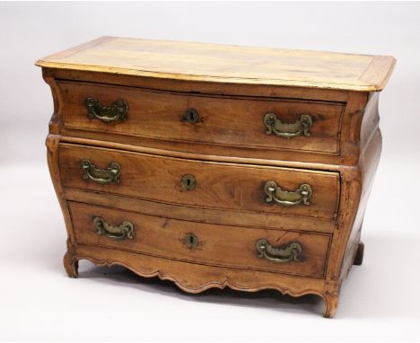 A GOOD 18TH CENTURY FRENCH WALNUT THREE DRAWER COMMODE, of bombe form, with serpentine front, carved corners, on scroll feet 