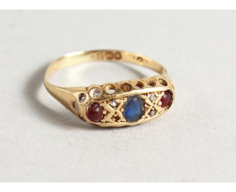 AN 18CT GOLD, RUBY AND SAPPHIRE RING.