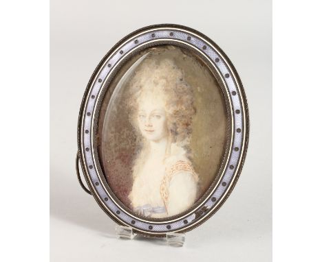A SILVER AND ENAMEL OVAL PHOTOGRAPH FRAME, portrait head and shoulders of a young lady. 5ins x 3.5ins.