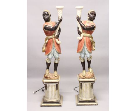 A PAIR OF PAINTED, CARVED AND BLACKAMOOR FLOOR STANDING NINE LIGHT CANDELABRA. 6ft 4ins high.