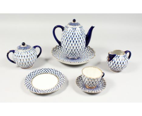A RUSSIAN PORCELAIN BLUE AND GILT TEA SET, comprising teapot, sugar basin and cover, milk jug, six cups and saucers, dish and