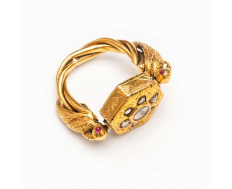  A DIAMOND AND RUBY-SET GOLD SWIVEL RING NORTHERN INDIA, 19TH CENTURY the octagonal-shaped gold head suspended from the insid