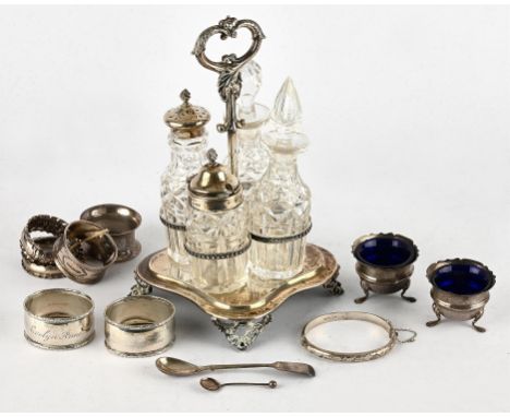 Victorian silver four bottle cruet stand by Henry Holland , London 1866, (non matching stoppers) pair of cauldron salts, two 