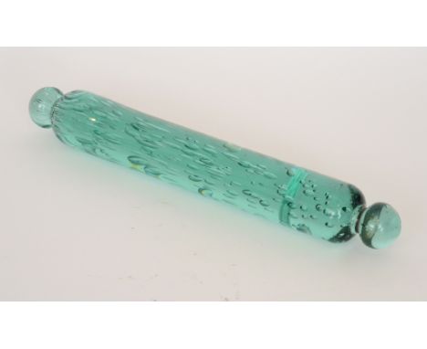 A 19th Century North Counties rolling pin of cylindrical form with ball knop ends, internally decorated with random air bubbl