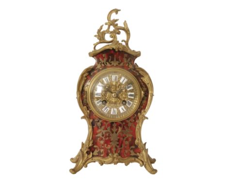 A Louis XVI style gilt metal and red tortoiseshell boulle work mantle clock, eight day striking movement, enamelled dial encl