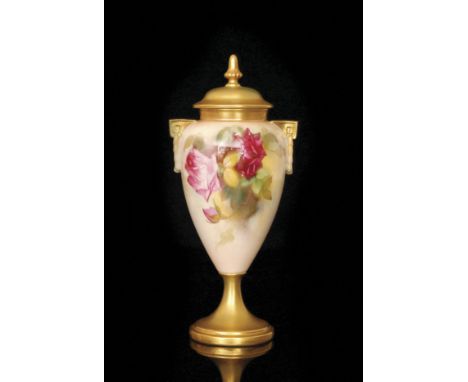 A Royal Worcester twin handled pedestal vase and cover decorated by Kitty Blake with hand painted roses and foliage to a pale