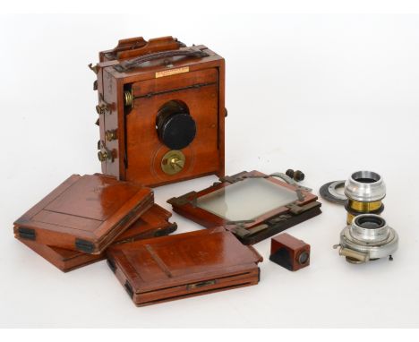 A 19th Century mahogany cased quarter plate camera by J Lancaster & Son Birmingham, with spare plates and lens together with 