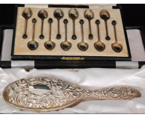 A George V hallmarked silver set of twelve coffee spoons, each with guilloche enamelled bowls and coffee bean finials, cased,