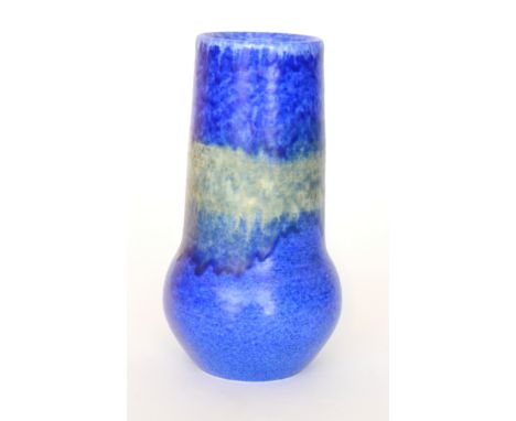 A Ruskin Pottery vase of globe and shaft form decorated with a mottled blue glaze with a band of green, impressed mark, incis