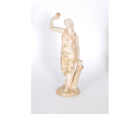 A large Royal Worcester figurine 'Captivity' modelled as a maiden dressed in robes holding aloft a dove in her hand, decorate