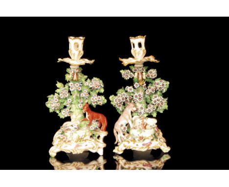 A pair of late 18th Century Chelsea (Aesop's) Fable candlesticks based upon the engravings by Francis Barlow, illustrated in 