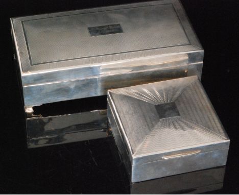 Two 20th Century hallmarked silver cigarette boxes, one of square form with Art Deco style engine turned decoration, the othe