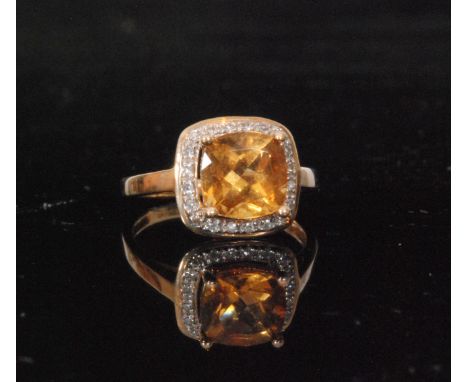 A 9ct hallmarked citrene and diamond cluster ring, square facet cut square claw set citrene within diamond surround to plain 