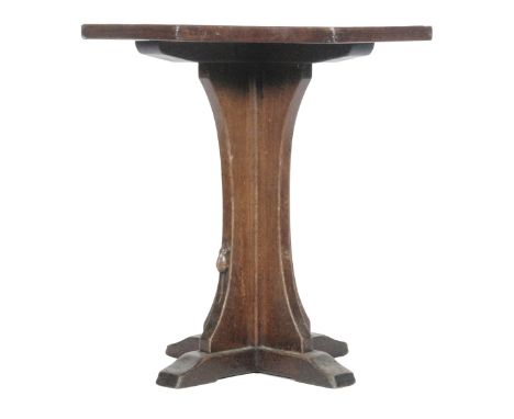 A Robert 'Mouseman' Thompson oak occasional table of octagonal form, the adzed top above a cruciform pedestal base with carve