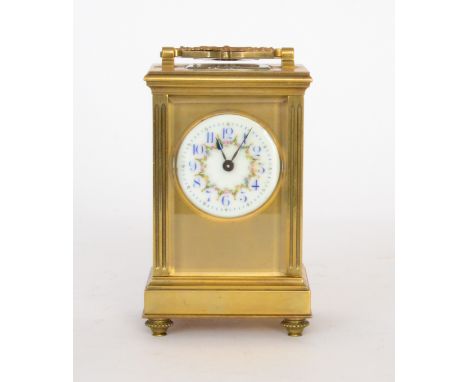 A 19th Century French brass carriage clock with circular painted Arabic dial below a laurel leaf handle, the movement stamped