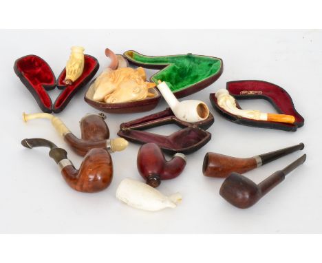 A 19th Century carved Meerschaum pipe modelled as a horse's head with flaming ears and nostrils by G Moller Berlin, another m