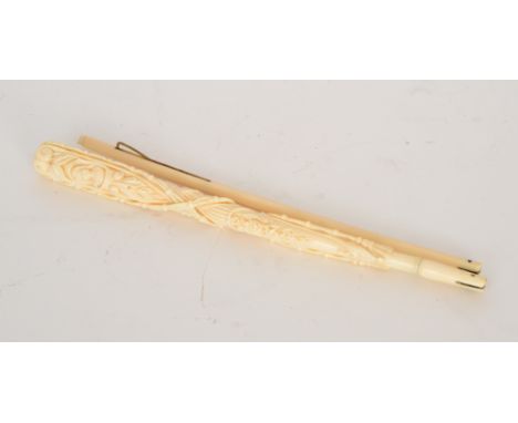 A late 19th to early 20th Century carved ivory carriage parasol handle, probably Dieppe, folding in two sections, the termina
