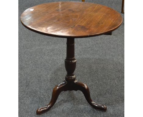 A George III circular tilt top table on turned vase pedestal and splayed tripod legs, diameter 69cm