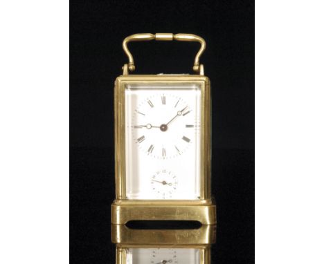 A 19th Century brass carriage clock with white enamelled dial, with subsidiary dial and striking on a bell on plinth base, he