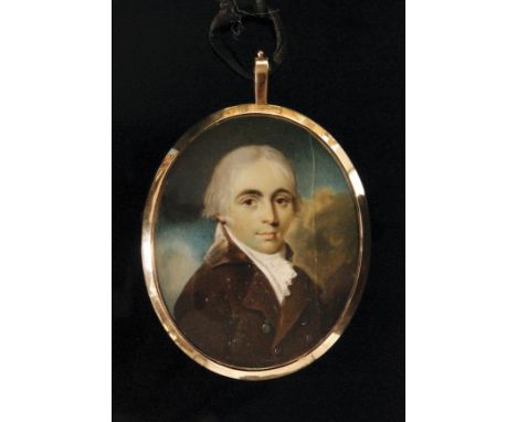 After George Engleheart, an early 19th Century oval portrait miniature of a young gentleman in a brown coat with velvet colla