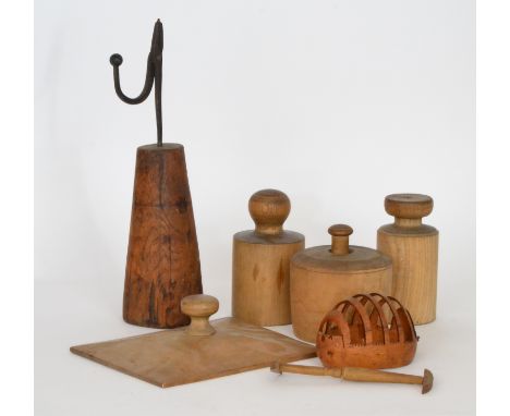 A collection of 19th and 20th Century kitchen and domestic utensils to include wooden butter moulds, a floral press pastry mo