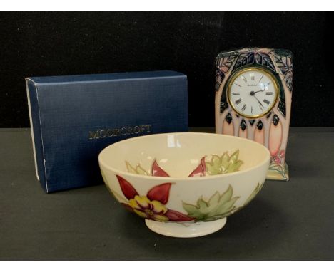 A Moorcroft pottery Cluny pattern mantel clock, 16cm high, boxed with sleeve;  a Columbine pattern circular bowl, cream groun
