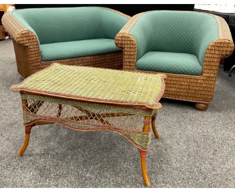 A cane conservatory suite, comprising sofa, measuring 77cm high x 160cm x 90cm, single armchair, and coffee table, (3). 