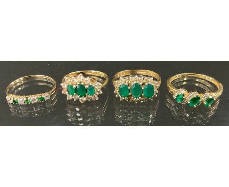 An emerald and diamond effect Cz cluster ring, 9ct gold shanks, sizes S &amp; Q, 6.4g gross;  a 9ct gold diamond and green ga