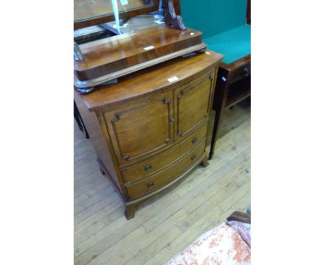 A Georgian mahogany bowfront commode chest of drawers.