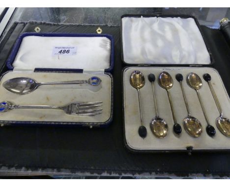 A cased set of six hallmarked silver and enamel finished coffee spoons with beaded ends, together with hallmarked silver Geor