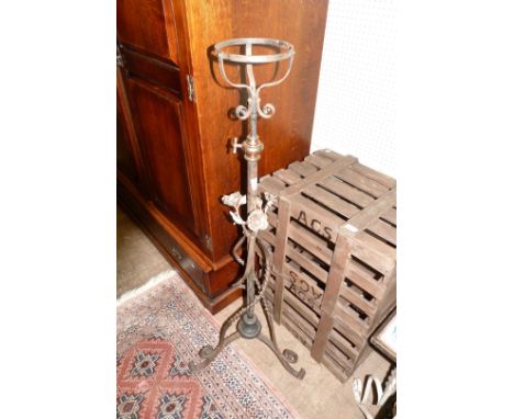 An Arts & Crafts oil lamp holder with copper floral applied decoration, in the manner of WAS Benson