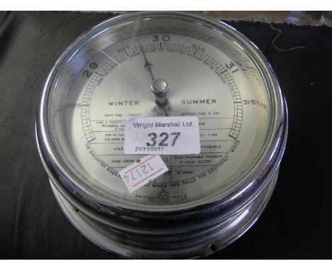 A 20th Century ship aneroid barometer by O. Comitti & Son London.