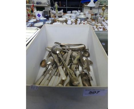 A collection of George III and later silver cutlery to include various spoons, sugar nips, mother of pearl handled dessert kn