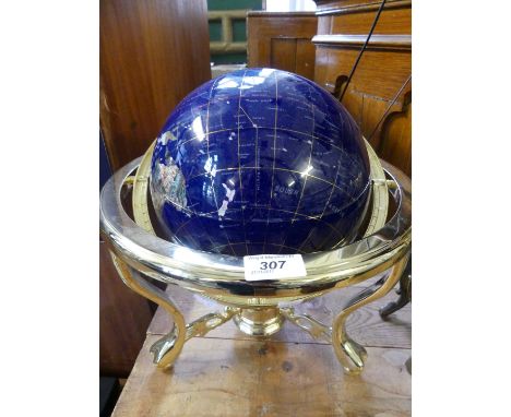 A modern hardstone and shell inlaid globe on brass finished stand.