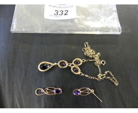 An amethyst and yellow metal suite, comprising a pair of drop earrings, and a pendant necklace detailed with four individual 