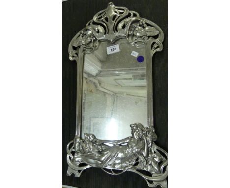 A contemporary wall mirror in Art Nouveau silvered finished frame.