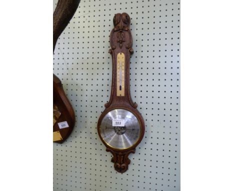 A modern oak banjo barometer of small proportions.