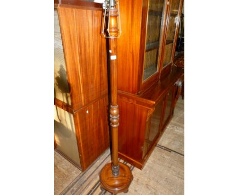 An early 20th Century mahogany standard lamp. (sold electrically untested).