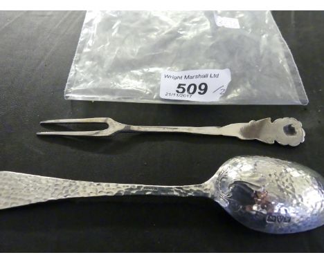 An unusual Chester hallmarked hammered silver spoon together with a further German 800 grade silver fork with rose shaped fin